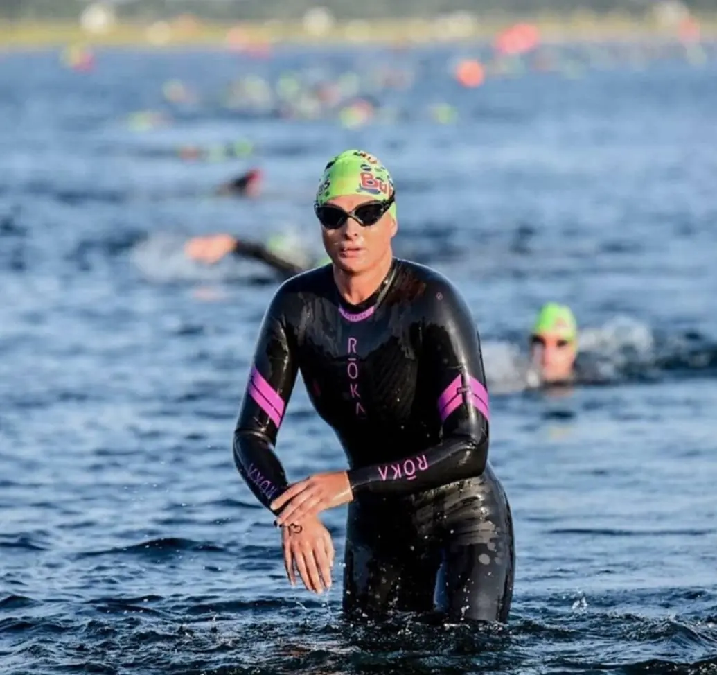 Jo Taylor emerging from the open water during a triathlon